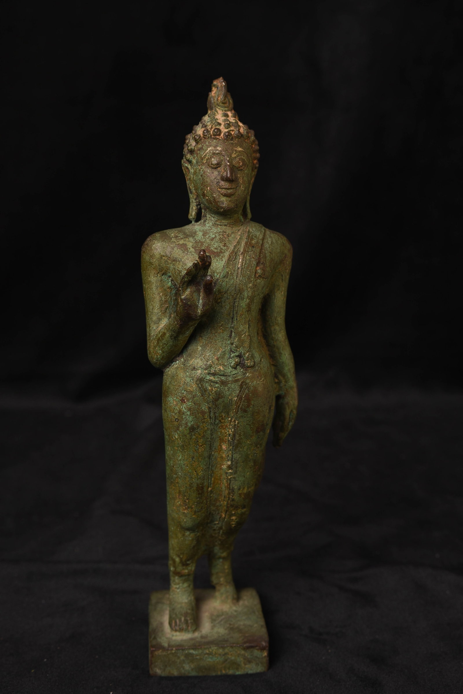 15/16th Thai Sukhothai Walking Buddha - well sculpted, cast and finished: 15/16th Thai Sukhothai Walking Buddha - well sculpted, cast, and finished. It is a really nice size at 9.75" by 2.5 inches wide and deep, with good weight. The bottom of the base was possibly filled