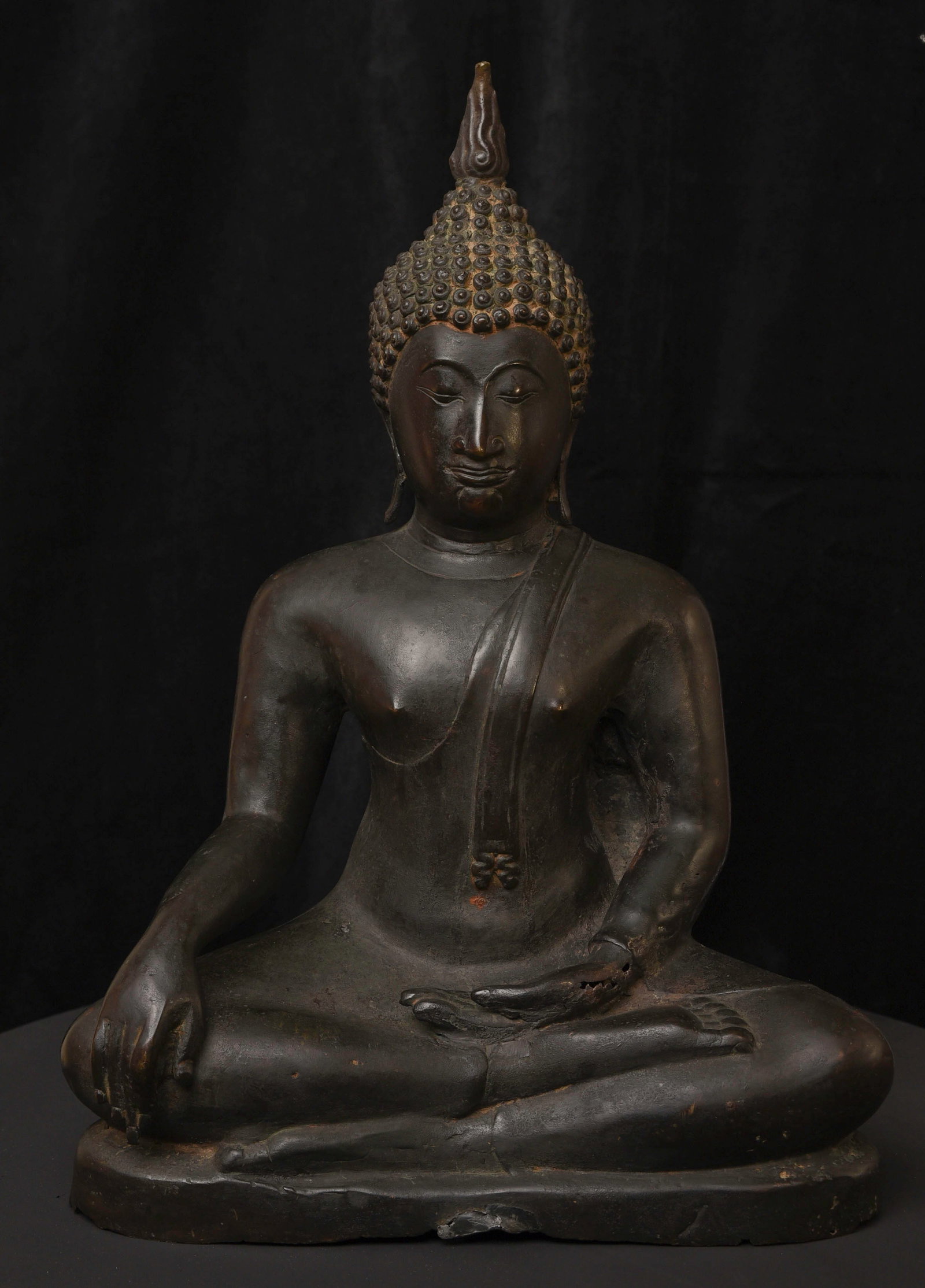 19th century or earlier Large Sukhothai (Thai) Bronze Buddha.: 19th century (possibly much earlier) Large Sukhothai (Thai) Bronze Buddha. Large, Lovely. Serene. Classic type. Flaw/damage in front of the base and very tip of the finial, otherwise good condition.