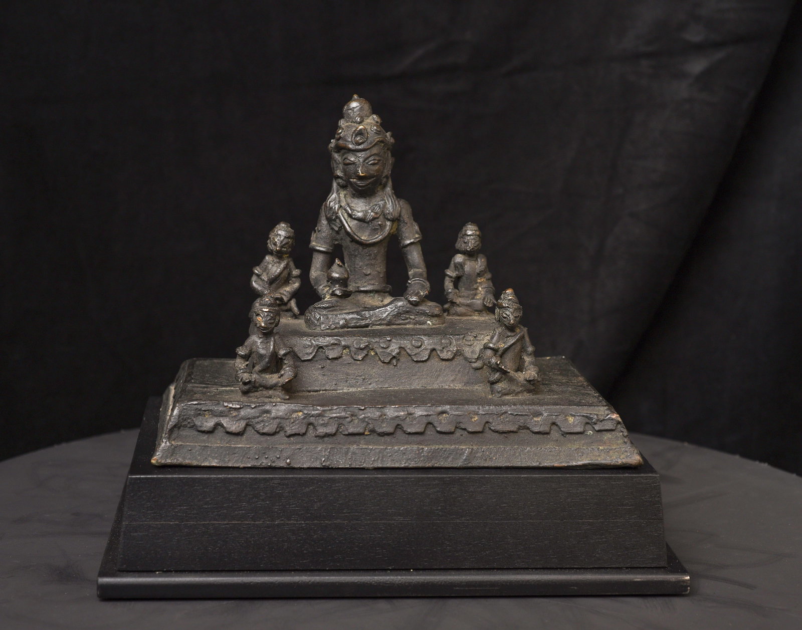 19C/earlier Java bronze Buddha with 4 attendants on large base-Animated, Joyful: Extremely uncommon 19C or earlier Java bronze Buddha with 4 attendants. I have never seen another like it before. From an old US collection. Recently made museum-style base. Very heavy!!! - ( 14lbs /