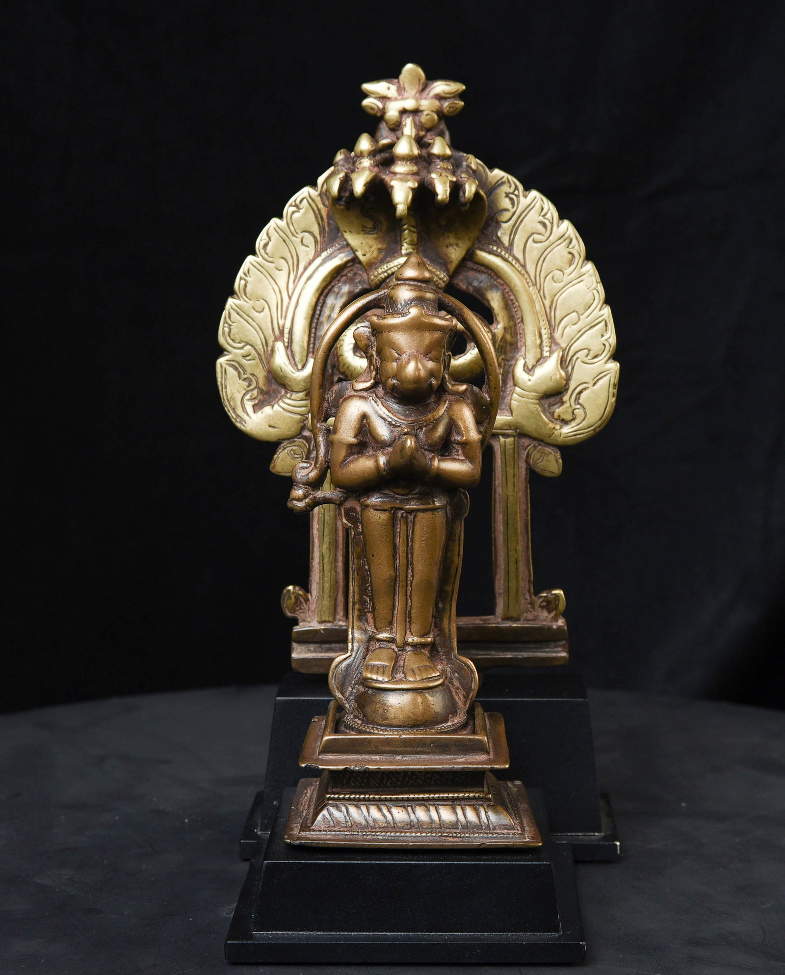 18thC Hanuman protected by nagas.-Very hard to find with original base+ backplate.: Wonderful 18thC Hanuman protected by nagas. Stands 8.75 inches tall. The widest point is 5-1/8 inches. Purchased by the previous owner from a well-known New York dealer in the 1960s. Note the