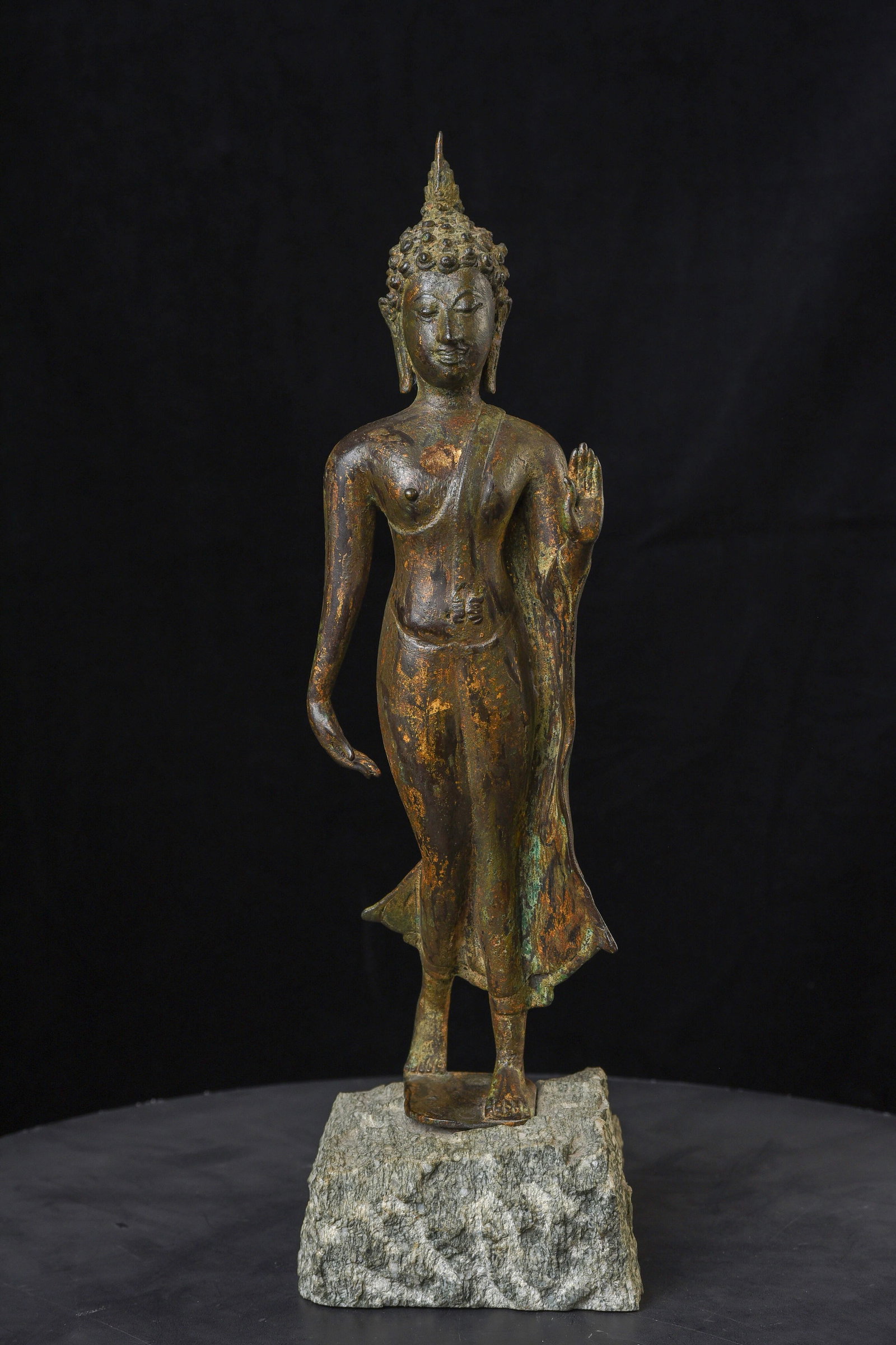 16/17thC Sukhothai Thai Walking Buddha. Well sculpted, cast, and finished.: 17-19th Sukhothai Thai Walking Buddha. Well sculpted, cast, and finished. Outstanding condition. Beautifully polished stone base. Much nicer than the typical end of 19th century/beginning of 20th cent