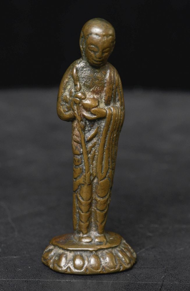 Very early solid-cast Tibet, Himalayan, Chinese, or silk road Buddhist monk or devotee.: Very early solid-cast Tibet, Himalayan, Chinese, or silk road Buddhist monk or devotee. Based on the style and overall look and feel, it likely is approaching 1,000 years old. The body has the elongat