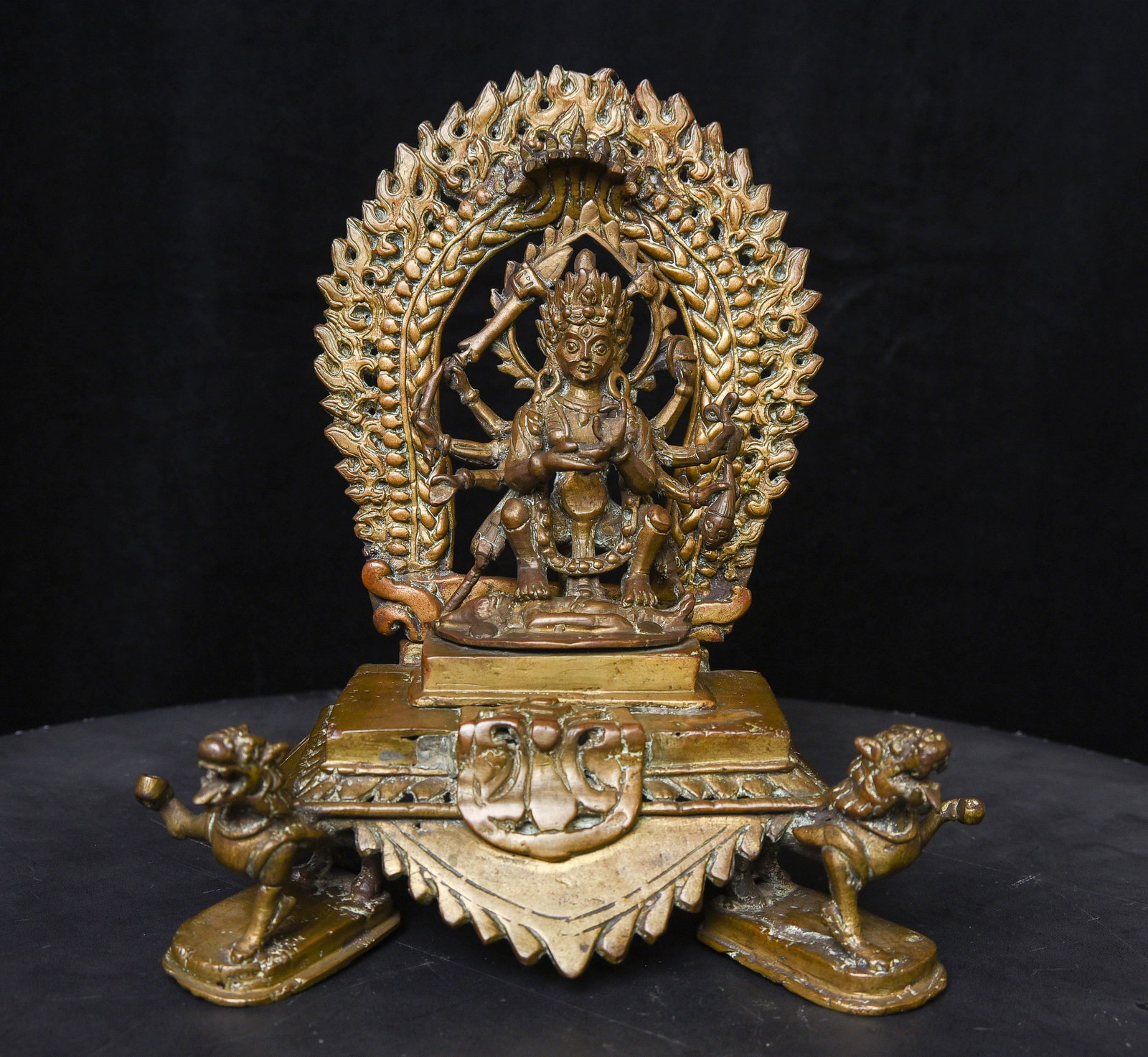 18/19thC Indian Hindu Bronze Shrine- Fierce Protective Multi-Arm Deity supported by Lions.: Indian Hindu Shrine of Fierce Protective Multi-Arm Deity on Shrine supported by Lions. - ( 7.25"H x 8"W - 4.18lbs / 1.890kg ). A fine example of its type.