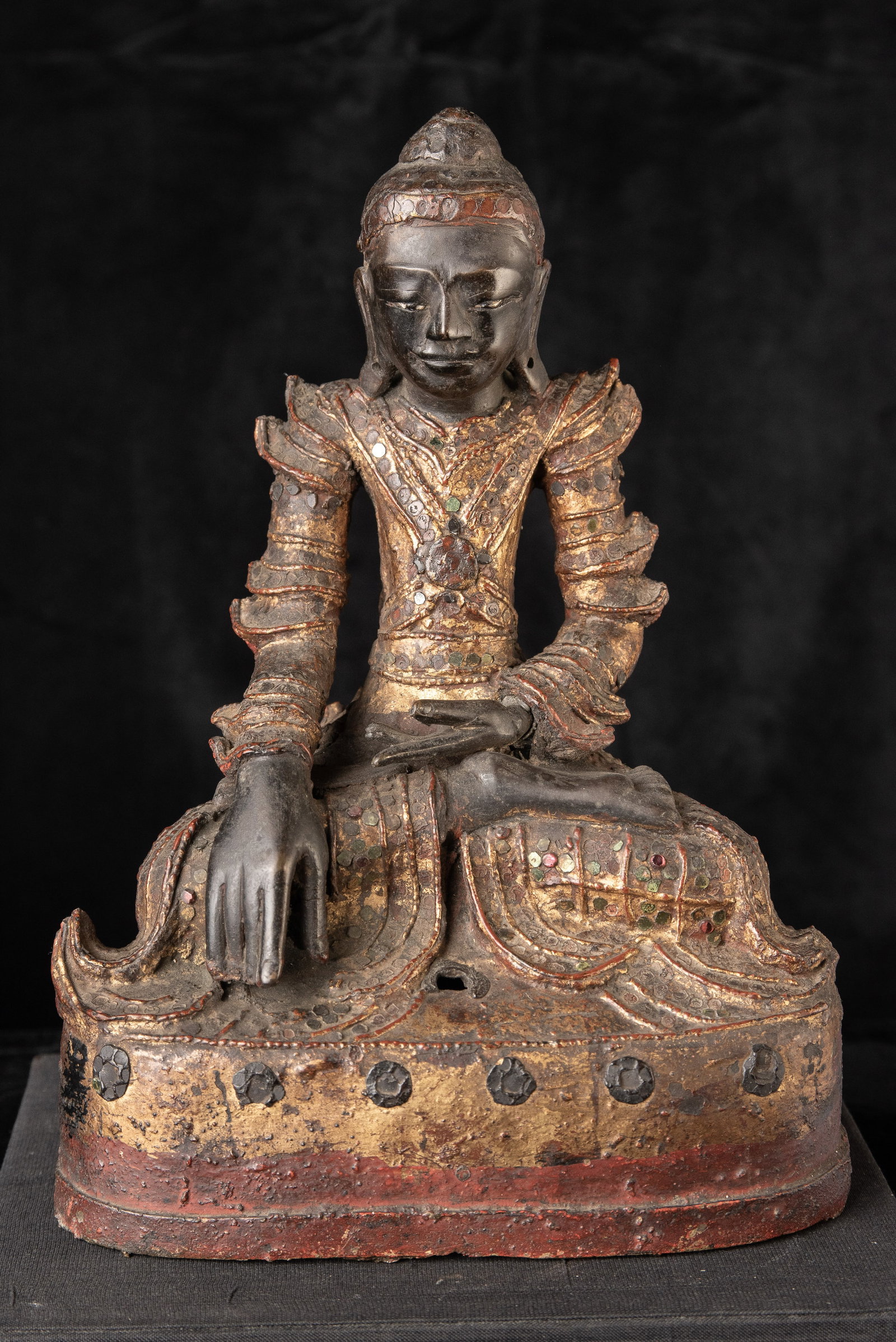 18/19th century bronze Burmese Mandalay style Buddha. A particularly beautiful example of a style: 18/19th century bronze Burmese Mandalay style Buddha. A particularly beautiful example of a style typically done in wood, but in this case cast in bronze. The reason it is typically Dunning wood is