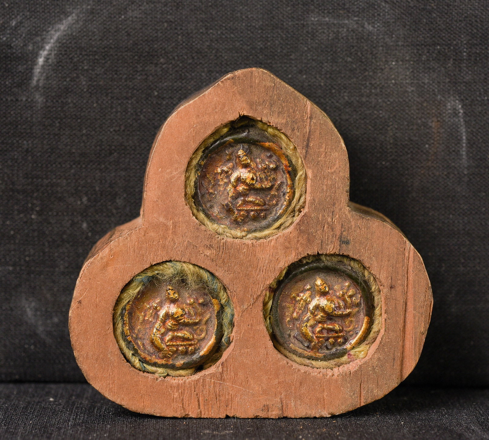 Three small old Mongolian tsa tsa's in a very provincial recent wooden gau. (1 of 5)