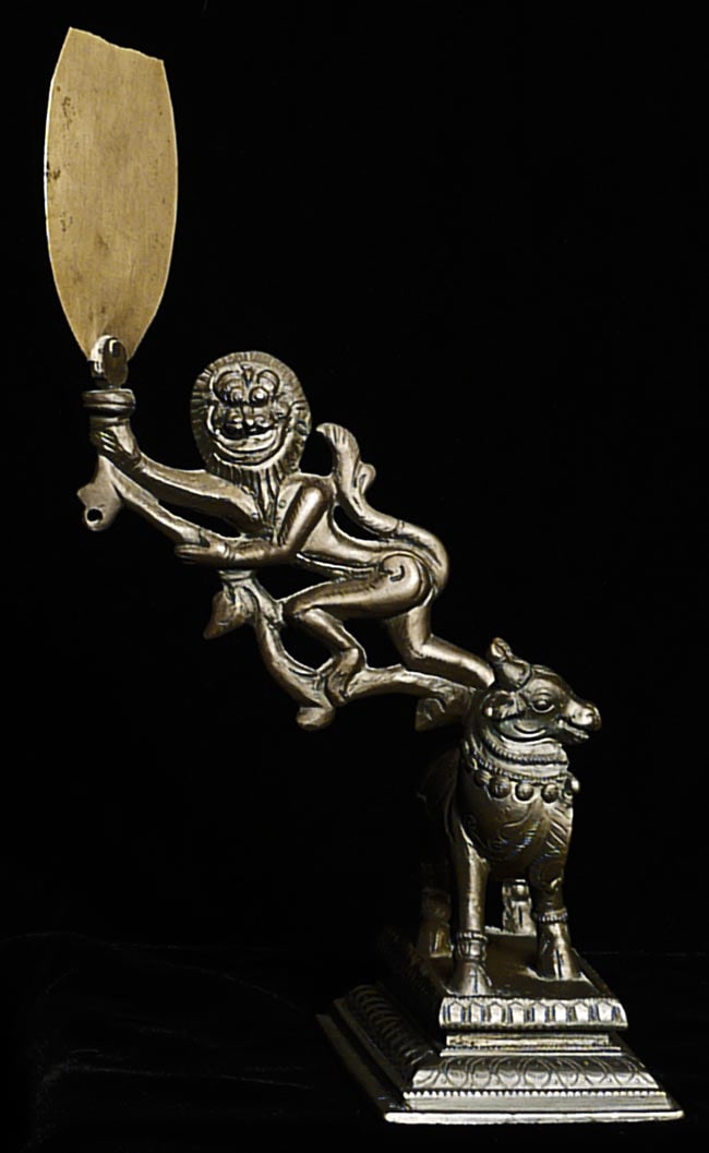 Very unusual bronze lion on cow. Loss of top of object: Very unusual bronze lion on cow. Loss of top of object in lion's hands- otherwise in super condition. Height to top of paddle is 8.75". Base measures 3 7/8" x 2 5/8".