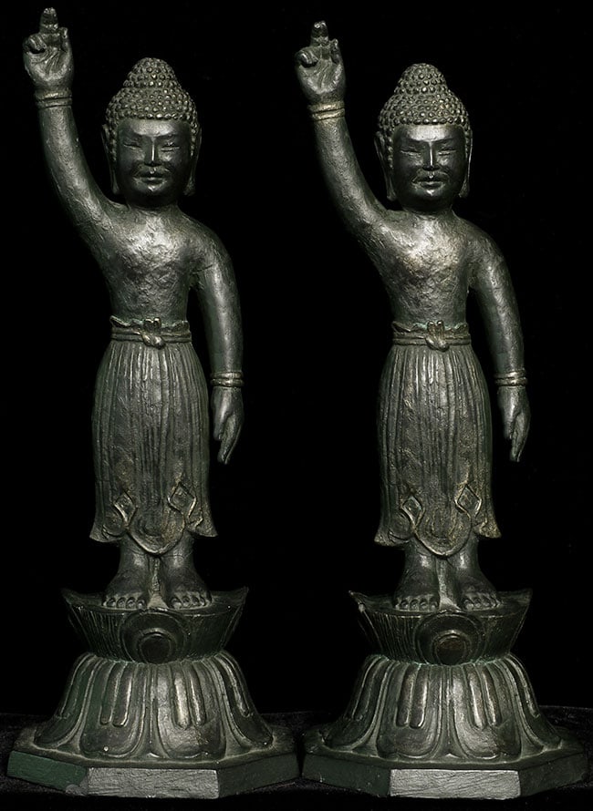 Decorative pair of vintage/old Japanese Baby Buddhas.: Decorative pair of vintage/old Japanese Baby Buddhas. Cast out of a resin or other mystery material. is 9.25" tall. Based on