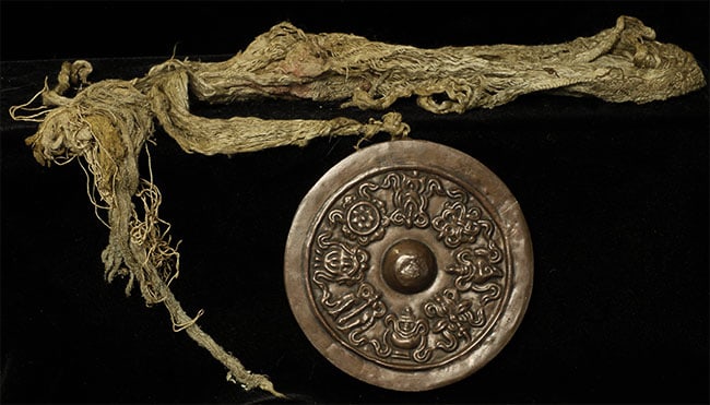 Stylized Antique Mongolian Copper Mandala.: Stylized Antique Mongolian Copper Mandala. Used to meditate on the freedom of suffering for all sentient beings. Diameter is 4 inches.