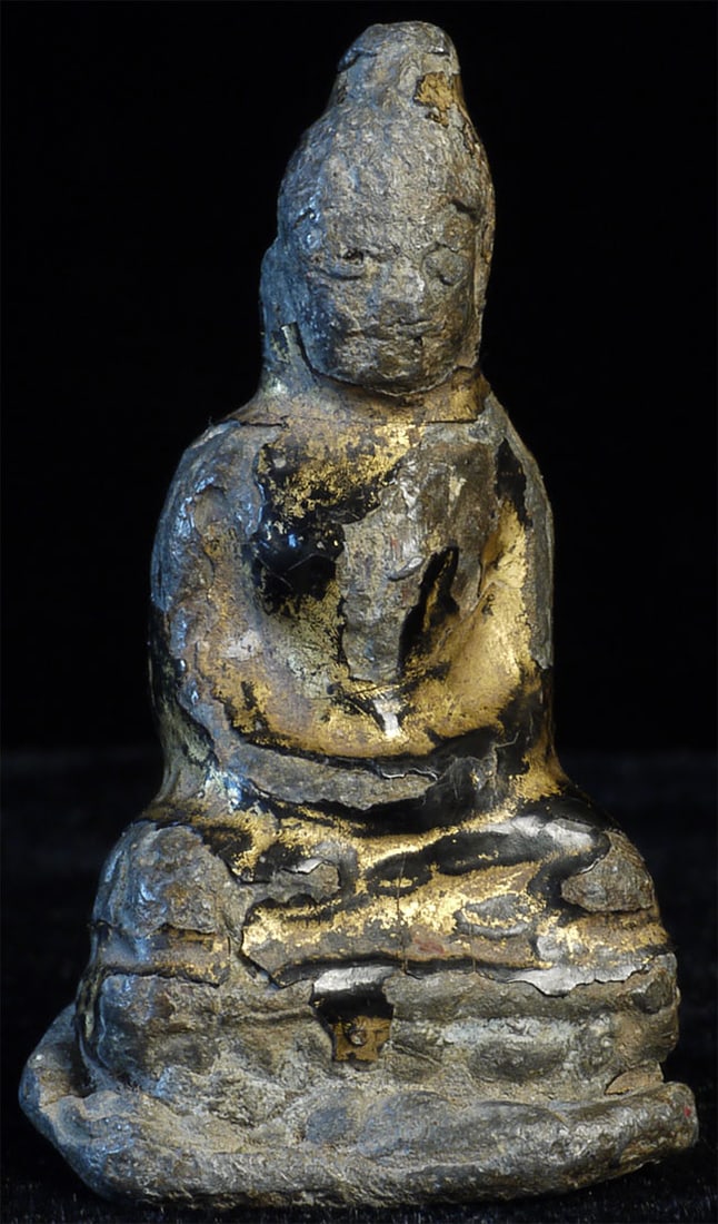14/15thC Northern Thai solid cast lead/bronze Buddha-Early Devotional Object: 14/15thC Northern Thai solid cast lead/bronze Buddha with remains of lacquer and gilding. Very powerful. Sits 1.5 inches tall. Deep discount. Look closely and you will see echoes of a beautiful face