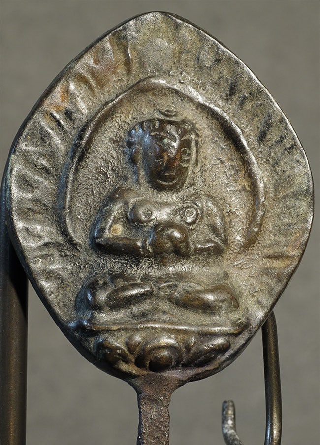 Mystery Buddha.: Mystery Buddha. Iron rod is 9.5 inches long, bronze Buddha sits 1 7/8 inches at widest point. Old- unsure of age or origin.