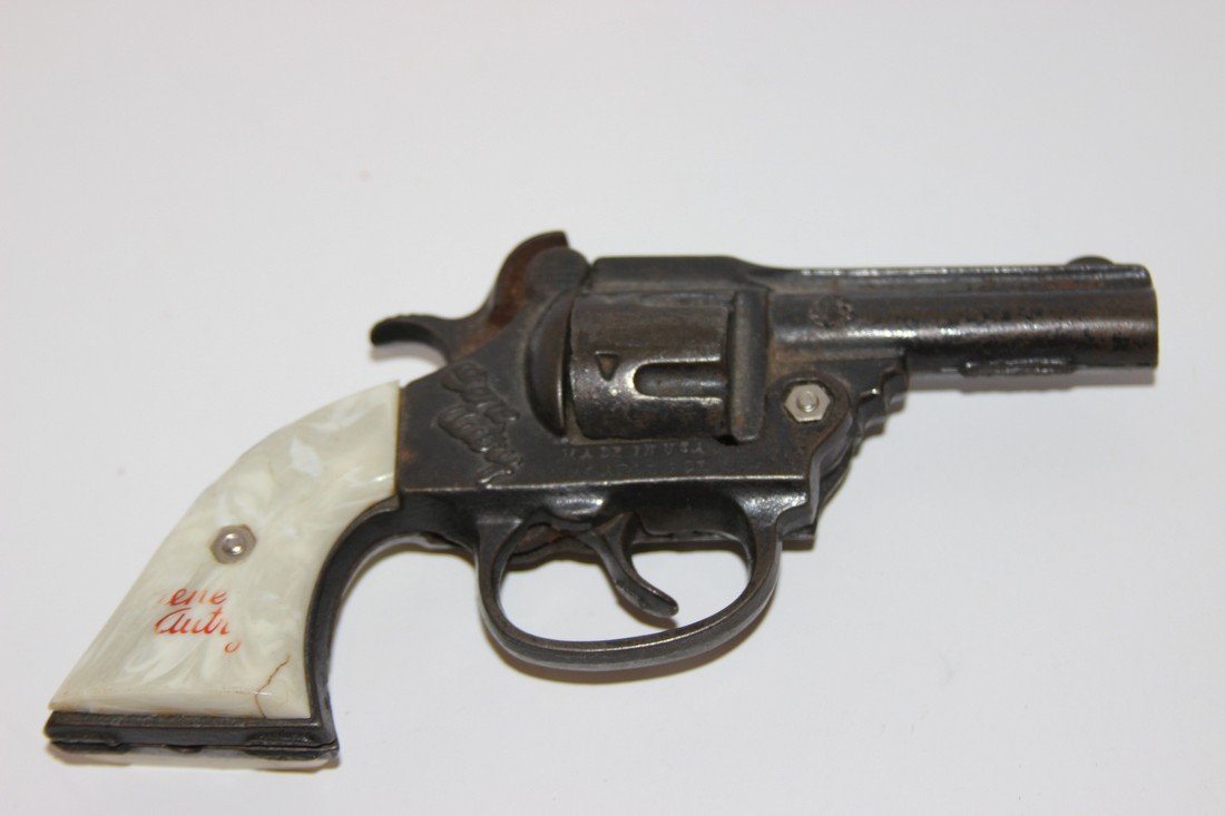 Gene Autry Toy Gun Fair Condition, plastic is cracked: Fair Condition, plastic is cracked on handle. It appears the screws have been replaced Plastic & Metal Approx. 7" long