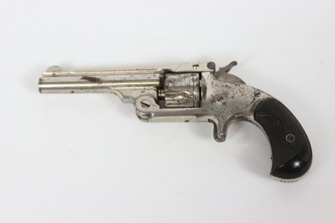 Smith & Wesson Top Break .32 cal Revolver: Last patent date of 1871 serial number 36838. very good overall condition retaining large portion of the nickel finish. barrel length 3.5"