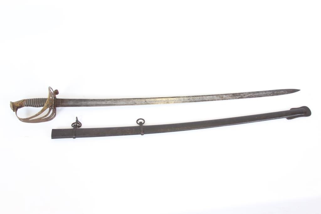 Union Staff & Field Officers Sword, German Made: Very good overall condition, complete with wire wrap leather grip and scabbard, Eagle in the basket, 32 1/2" etched blade, complete with scabbard. Note: scabbard is missing the collar