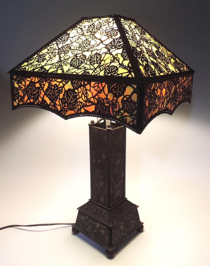 Grapevine Filigree Lamp Attr.to Riviere Studios: Circa 1920, filigree metal over slag glass in a Grapevine pattern, attributed to Riviere Studios, has spurious Tiffany & Co Broadway tag affixed to underside of base, 22: tall, 13" square