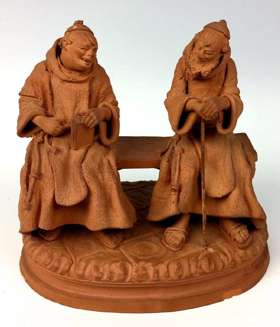 Italian Terracotta Group of Two Monks: Depicting 2 finely carved terracotta figures of monks sitting on bench in discussion, signed "Grasso" on lower right, marked "Made in Italy", has minor chip around front base, 5" x 5"