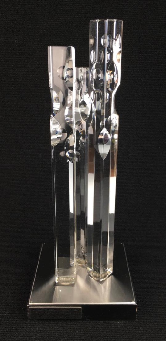Orrefors "Metropolis 1/73" Modern Glass Sculpture: Jan Johansson, Sweden, three graduated square pillars decorated with rounded imprints and grooves fitted on a square wood base, has metal plaque at base inscribed "Orrefors Sweden art in crystal Jan J
