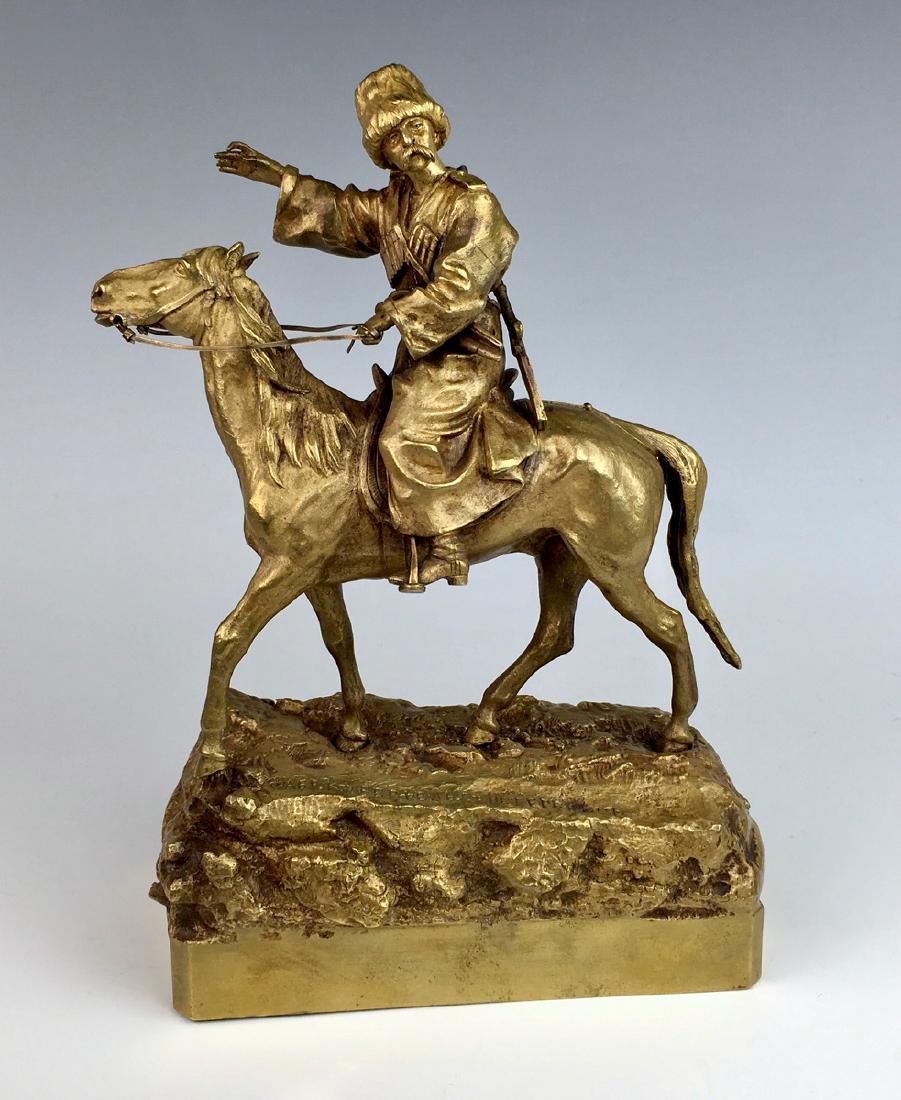 Imperial Period Antique Russian Bronze of Cossack: By Grachev (1831-1905), depicting a Cossack on horseback, raised on an integral naturalistic base, signed and inscribed in Cyrillic on the base, after Vassili Yacovlevitch Grachev, gold gilt patina, v