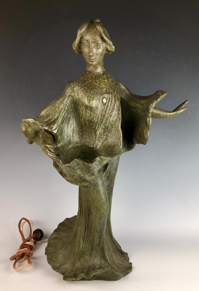 J. Causse (1869-1914) Art Nouveau Lamp C. 1900: Made of terra cotta, Causse was a prolific French sculptor during the art nouveau period, this figural depicts a maiden with flowing dress which conceals a socket for light, has mottled green paint, s