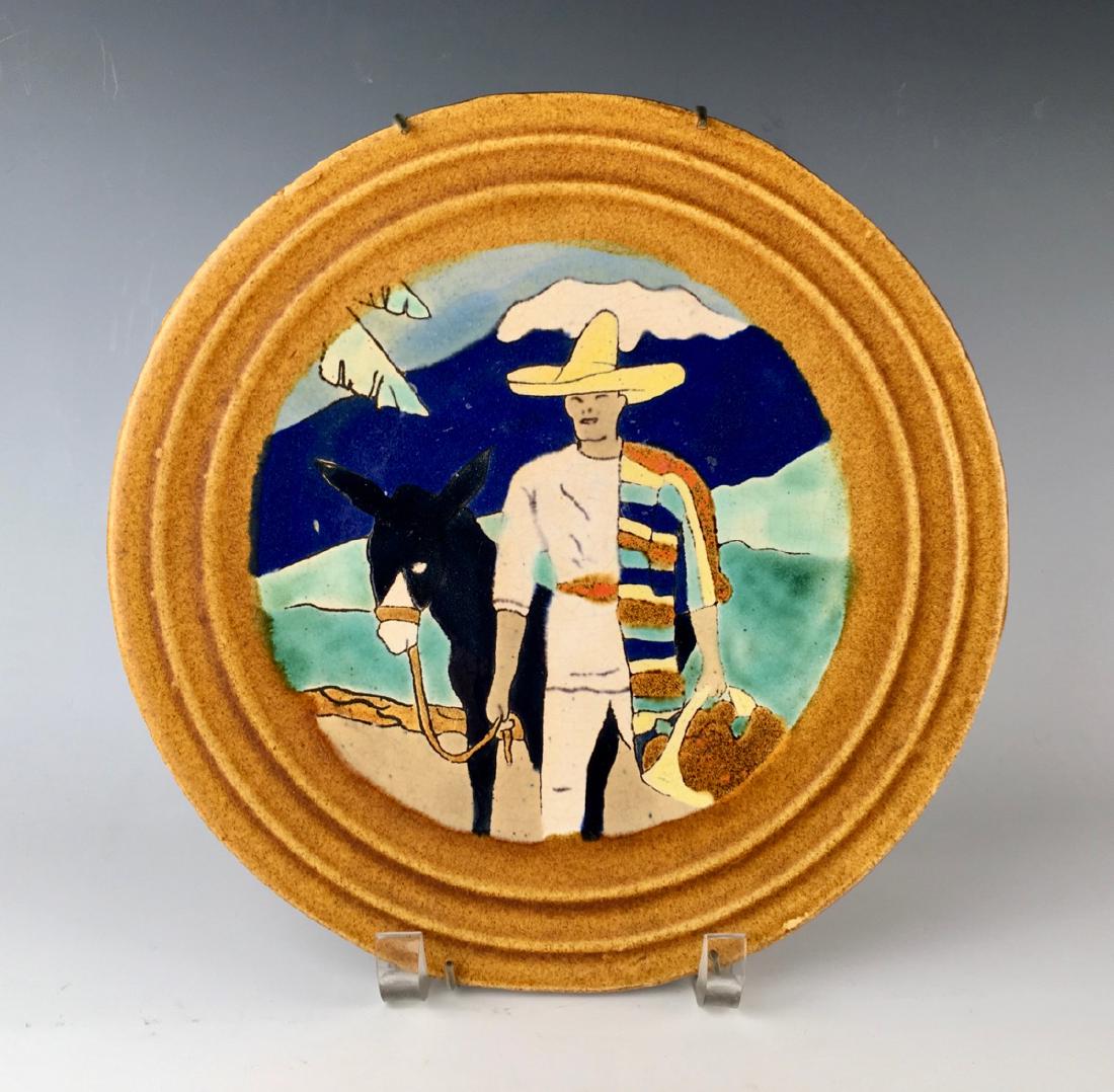 San Jose Pottery Plate "Orange Farmer": Glazed ceramic, depicts a farmer with his burro carrying oranges, mountains in the background, very good condition, 10" diameter