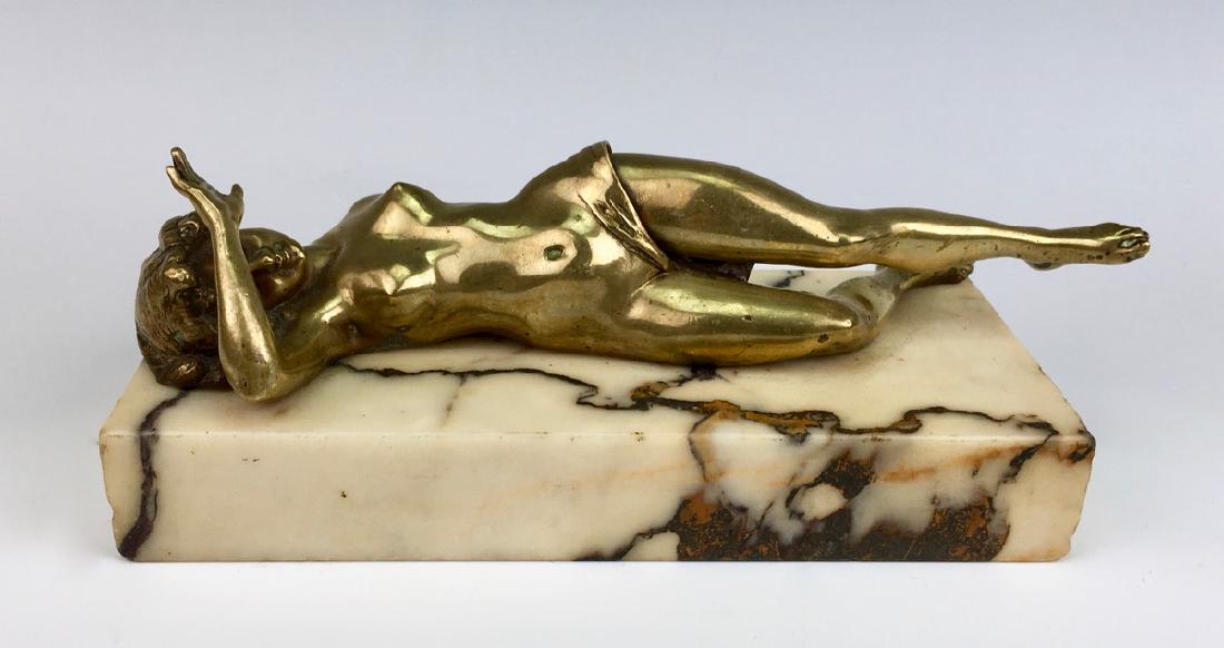 Naughty Nude Bronze Cigar Cutter C.1880: Depicting a nude lady reclining on a marble plinth, one leg is moveable to open up revealing a cigar cutter, very good condition, 8.5" x 3.5" x 3"