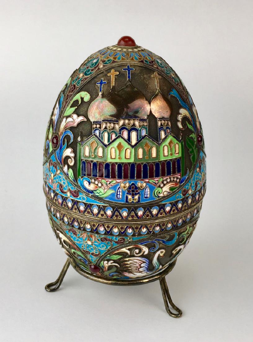 Russian Silver & Enamel St. Petersburg Egg: Top half depicts Russian churches while the bottom half is decorated with swans, top has carnelian cabochon and 6 garnet cabochons mounted on sides, has hall marks "84 (crossed anchors and a sceptor),
