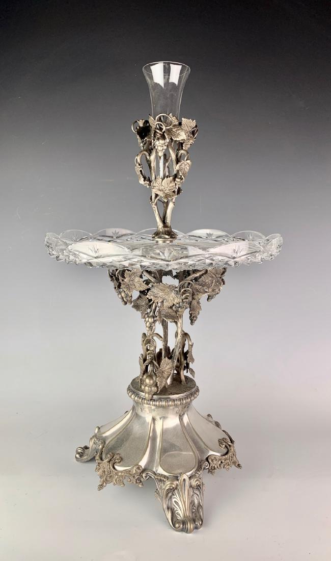 Antique Eng. Silver Plate & Cut Glass Centerpiece: Circa 1900, English silver plate, having clusters of grapes with leaves and vines, cut glass plate in center and glass vase in another cluster holder, good condition, wear commensurate with age, 19.75