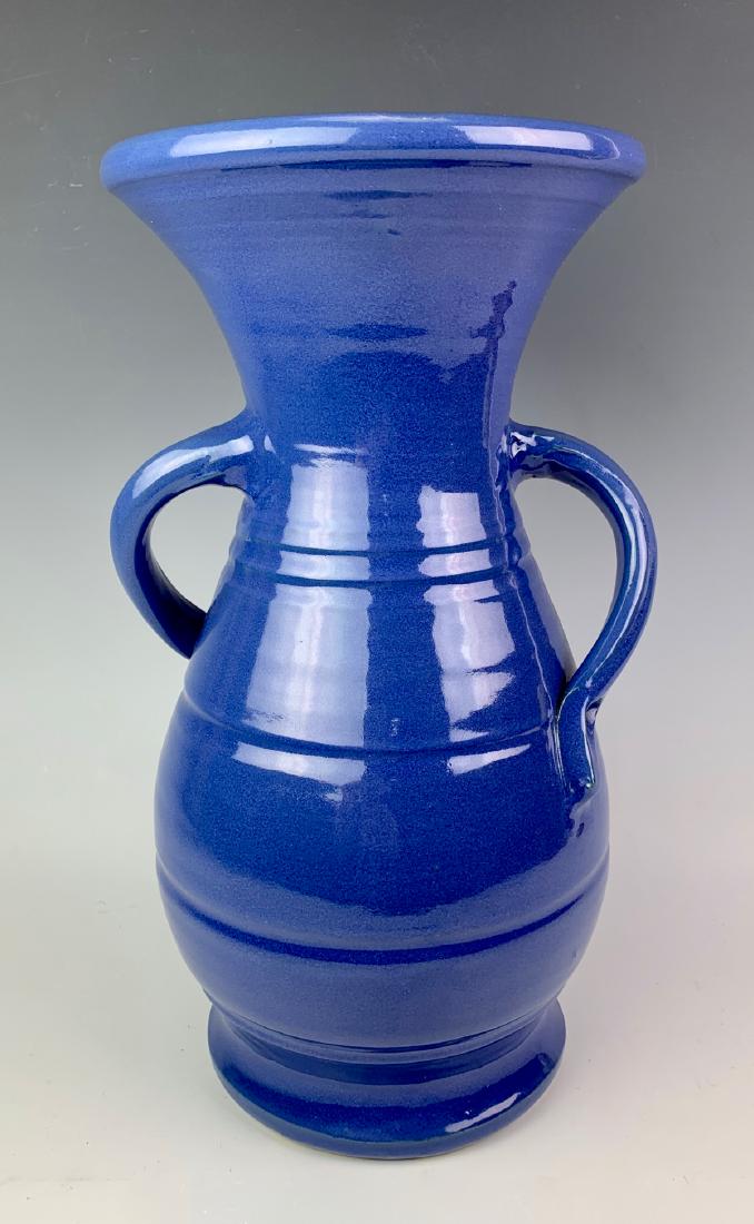Bauer Matt Carlton "Hands on Hips" Pottery Vase: Bauer Matt Carlton twisted handled pottery vase, hand thrown form with navy blue glazes, good condition, 14" height**Please note: after a thorough inspection, an old crack was found**