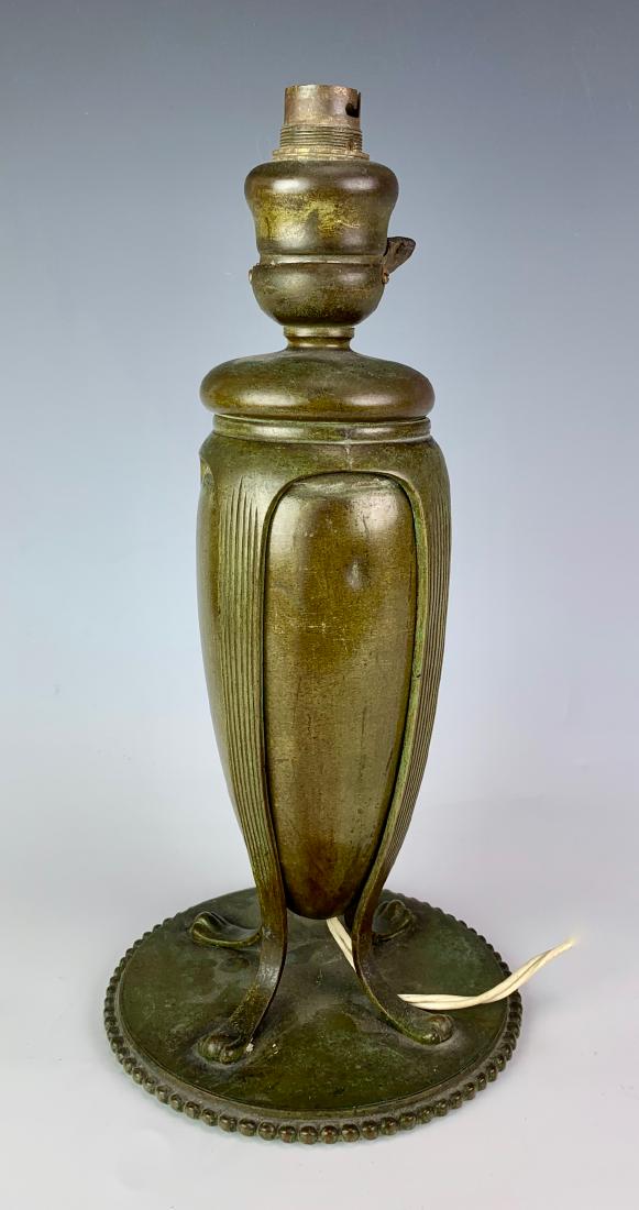 Tiffany Studios Bronze Urn Lamp Base: Bronze with brown green patina, marked with Tiffany Studios monogram and "Tiffany Studios New York" and "28639", minor dent, has European socket, needs re-wiring, 13" height