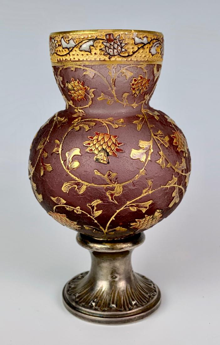 Daum Nancy "Thistles" Vase w/ Silver Pedestal: Circa 1900, having golden thistles cut out against a purple frosted background, having a silver pedestal with punch marks, signed "Daum Nancy" under base, very good condition, 4.25" height