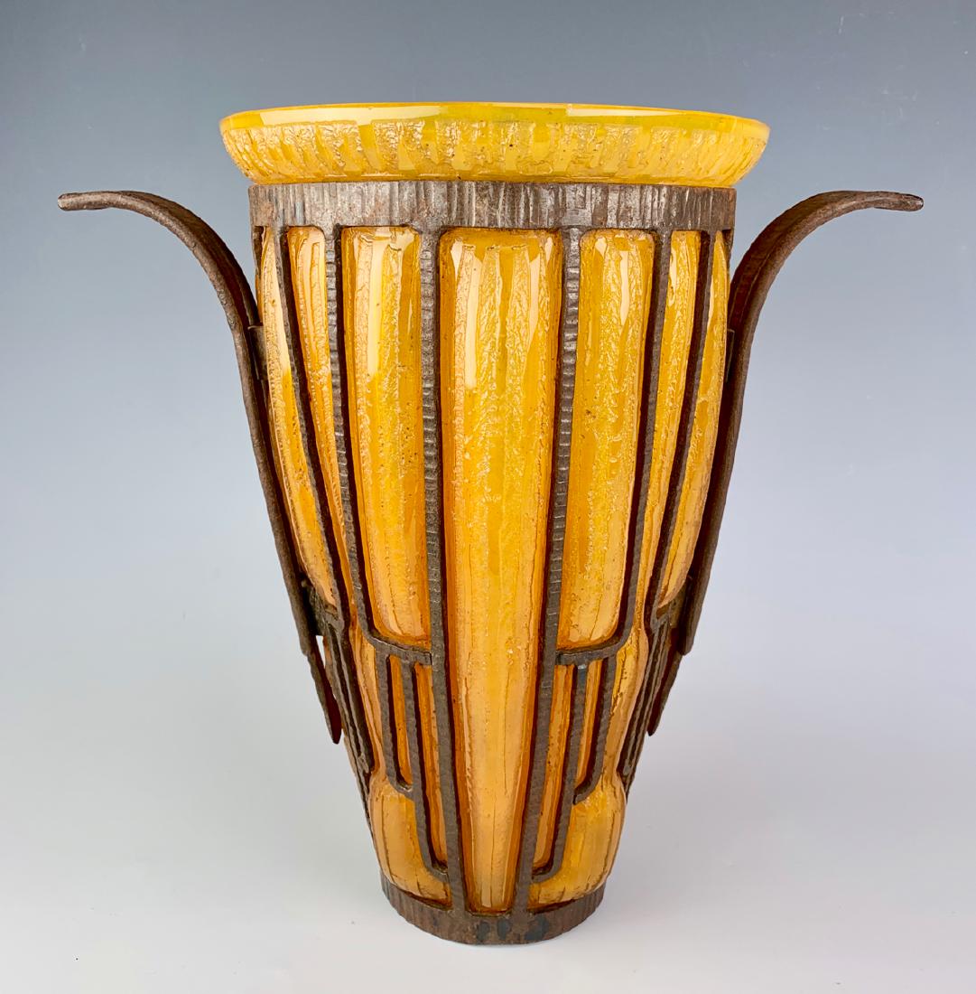 Daum Nancy & Louis Majorelle (1856-1929) Vase: Having an ovoid vase in yellow stained brown glass with an acid etched decor and frosted in a wrought iron frame with convex loops, signed on bottom "Daum Nancy France & Majorelle", minor small chip a