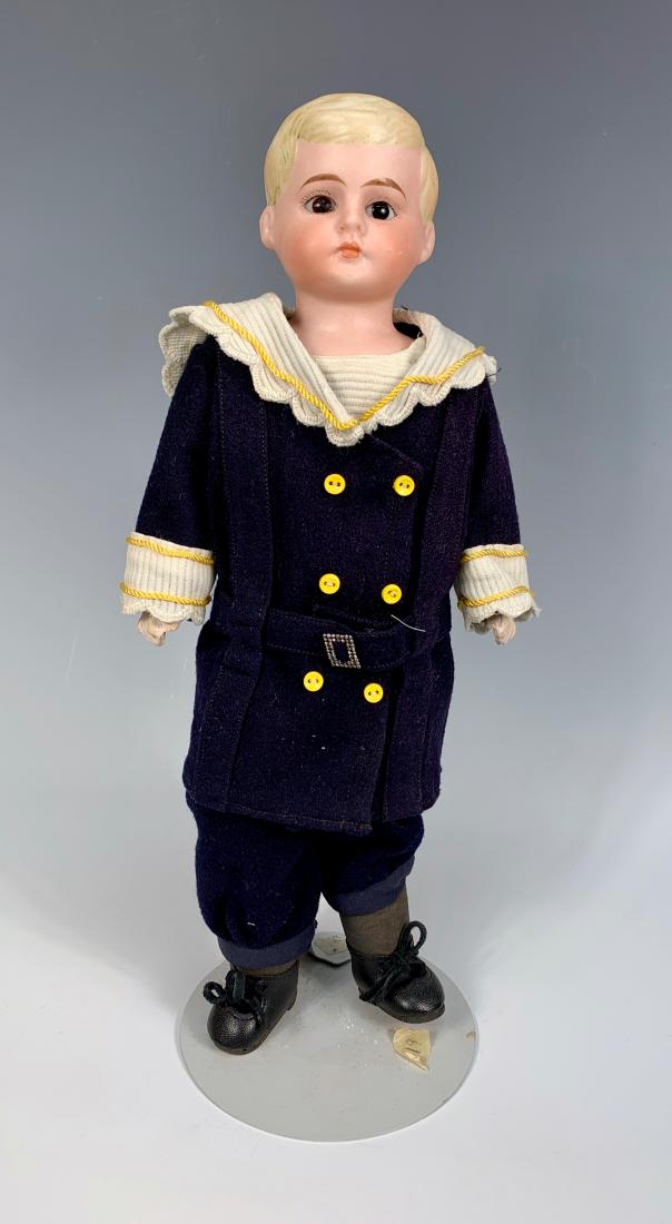 German Bisque "American School Boy" C. 1890: Brown glass eyes, molded blond hair with side part, composition lower arms, back of shoulder pate marked "9/10", antique cloth body, mariner's costume made with old fabric, very good condition, 13.5"