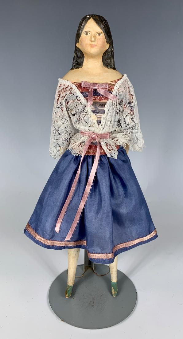 German Papier Mache Milliner's Model C. 1840: Brown painted eyes, leather body with wooden lower arms and legs, some touch-up to arms and legs, retouched hair and repainted face, fair condition, 13"