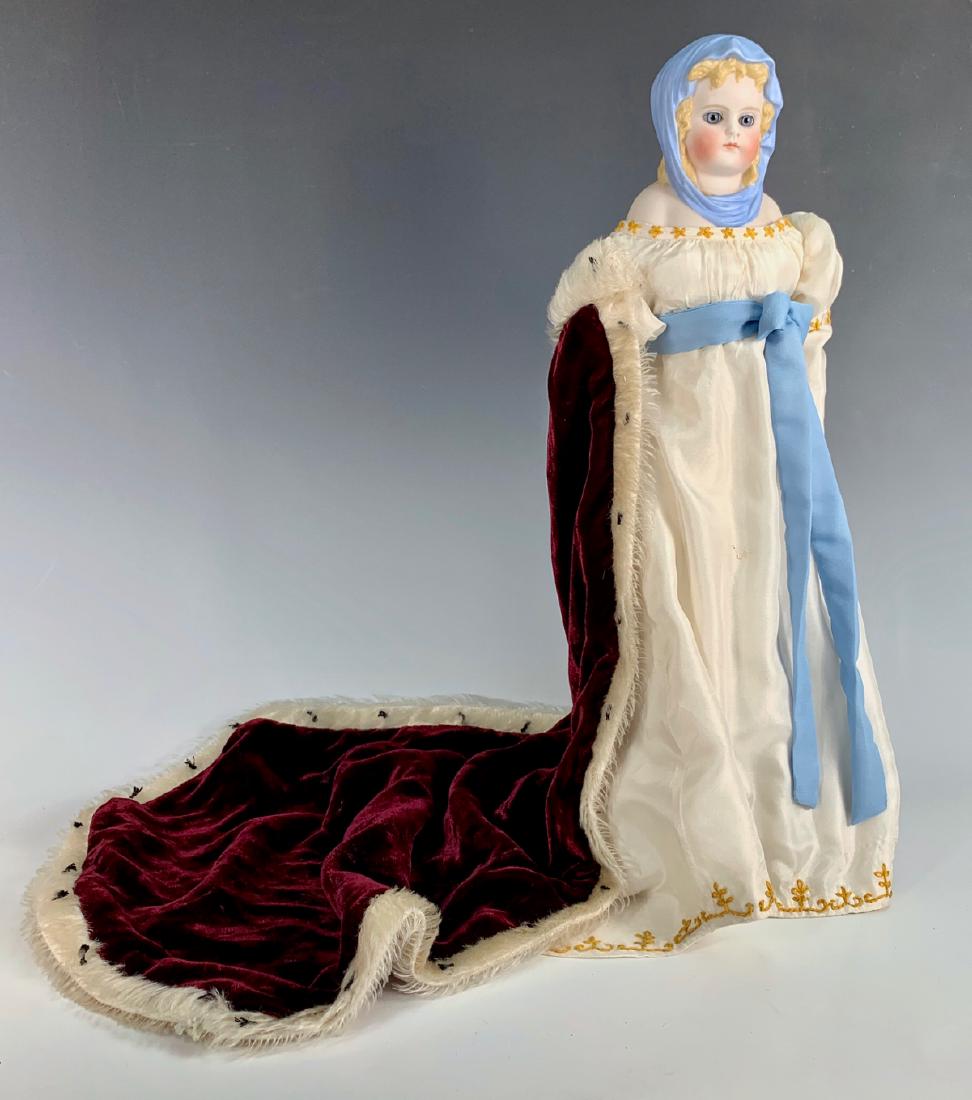 German Blue Scarf Parian "Queen Louise" C. 1870: Modeled after Queen Louise of Prussia, blue glass eyes, richly molded blond curls peeking out from under molded and draped blue scarf, newer cloth body with parian arms, porcelain fancy boots with bla