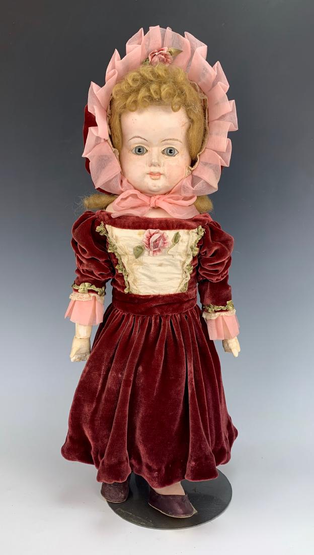 German Wax Over Papier Mache Doll C. 1860: Blue glass eyes, open/closed mouth with teeth, newer mohair wig, replaced hands made with plaster, one with broken fingers and one broken at wrist, papier mache lower legs, clothing made with old fabr