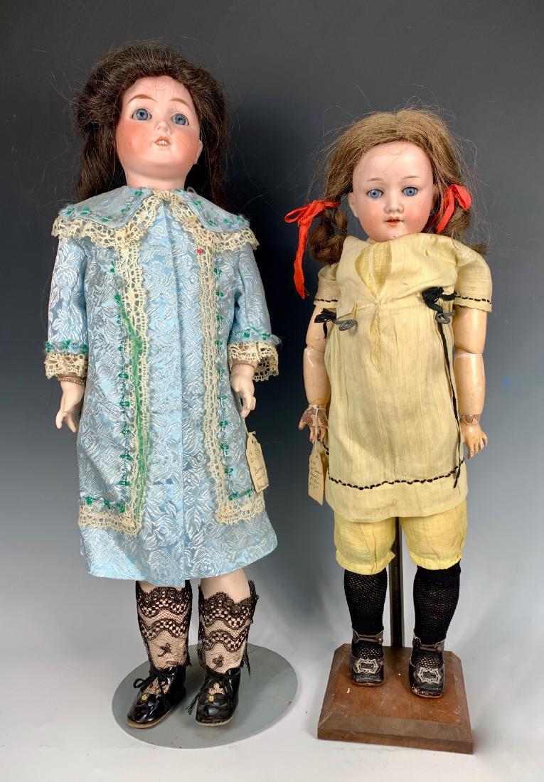 1 Gans & Seyfarth and 1 Armand Marseille: One c. 1890 Gans & Seyfarth, blue glass sleep eyes (stuck), fully-jointed composition body, open mouth with teeth, human hair wig, body repainted, 23"; one c. 1890 Armand Marseille "Mabel" shoulder he
