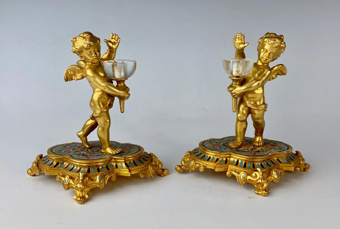 Pair Gilt Bronze & Champleve Cherub Candlesticks: Late 19th century, French, depicting a winged cherub holding glass bobesch for candles, very good condition, 5" height
