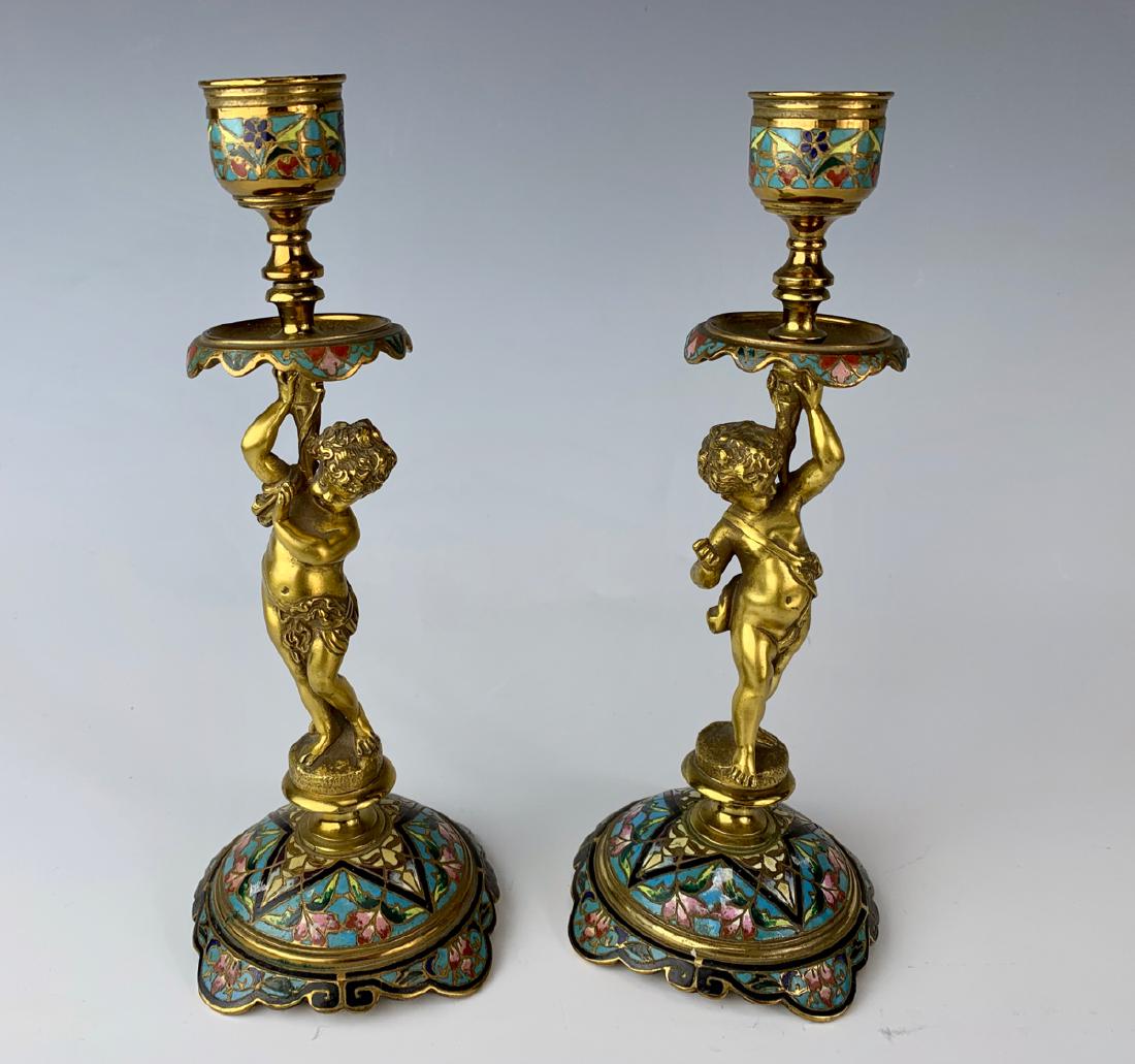 Pair Gilt Bronze & Champleve Putti Candlesticks: Late 19th century, French, each putti holding up the candle cups while standing on gilt bronze and champleve enamel base, very good condition, 8.375" height