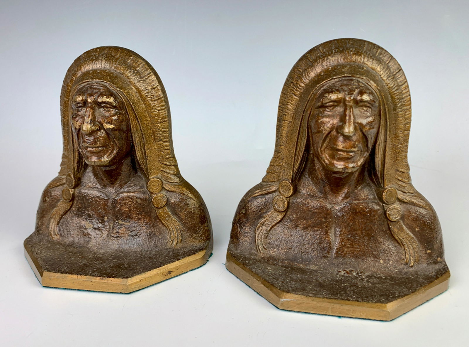 Pair Antique Cast Iron Native American Bookends: Circa 1910, cast iron bookends modeled as native American chiefs, original paint, very good condition, 5.25" x 5"