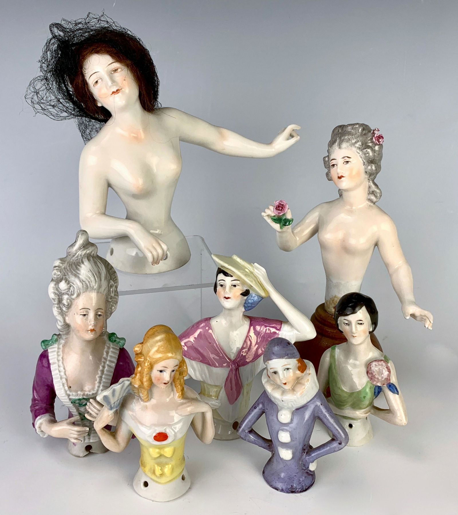 Group of Vintage Porcelain Half Dolls: Consisting of one with real hair, marked "Made in Germany" and factory mark, 6 smaller porcelain half dolls, 1 has broken finger, 5" tallest