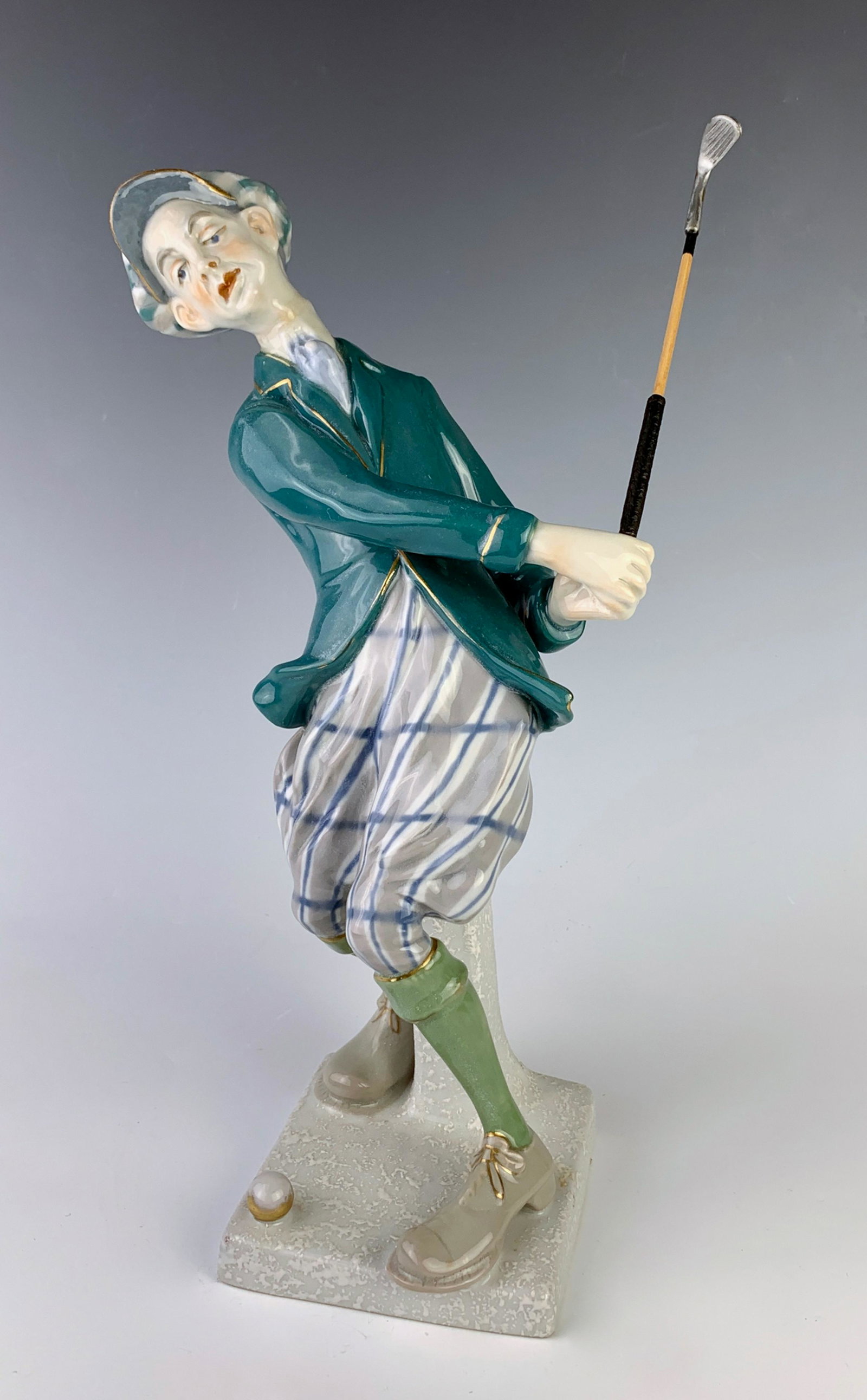 Amphora Porcelain Golfer: Having a humorous porcelain golfer dressed in 1930's golf clothes, marked "Made in Czechoslovakia" and Amphora mark, very good condition, 12.5" height