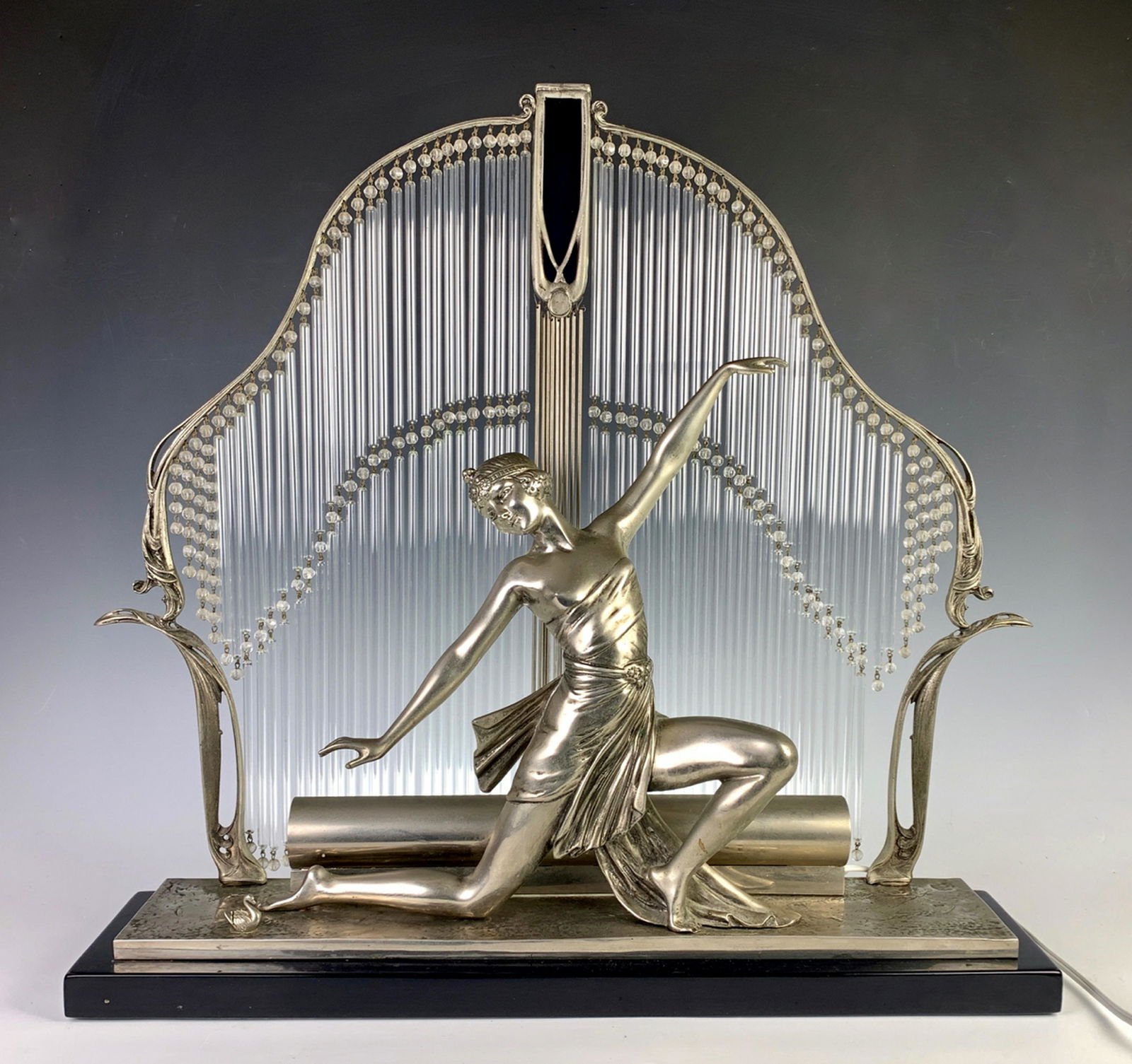 After Hector Guimard Large Art Deco Figural Lamp: Signed Guimard, silver plated bronze French figural lady kneeling dancer, decorated by a row of graduated glass tubes, very good condition, 26.75" x 25" x 6"
