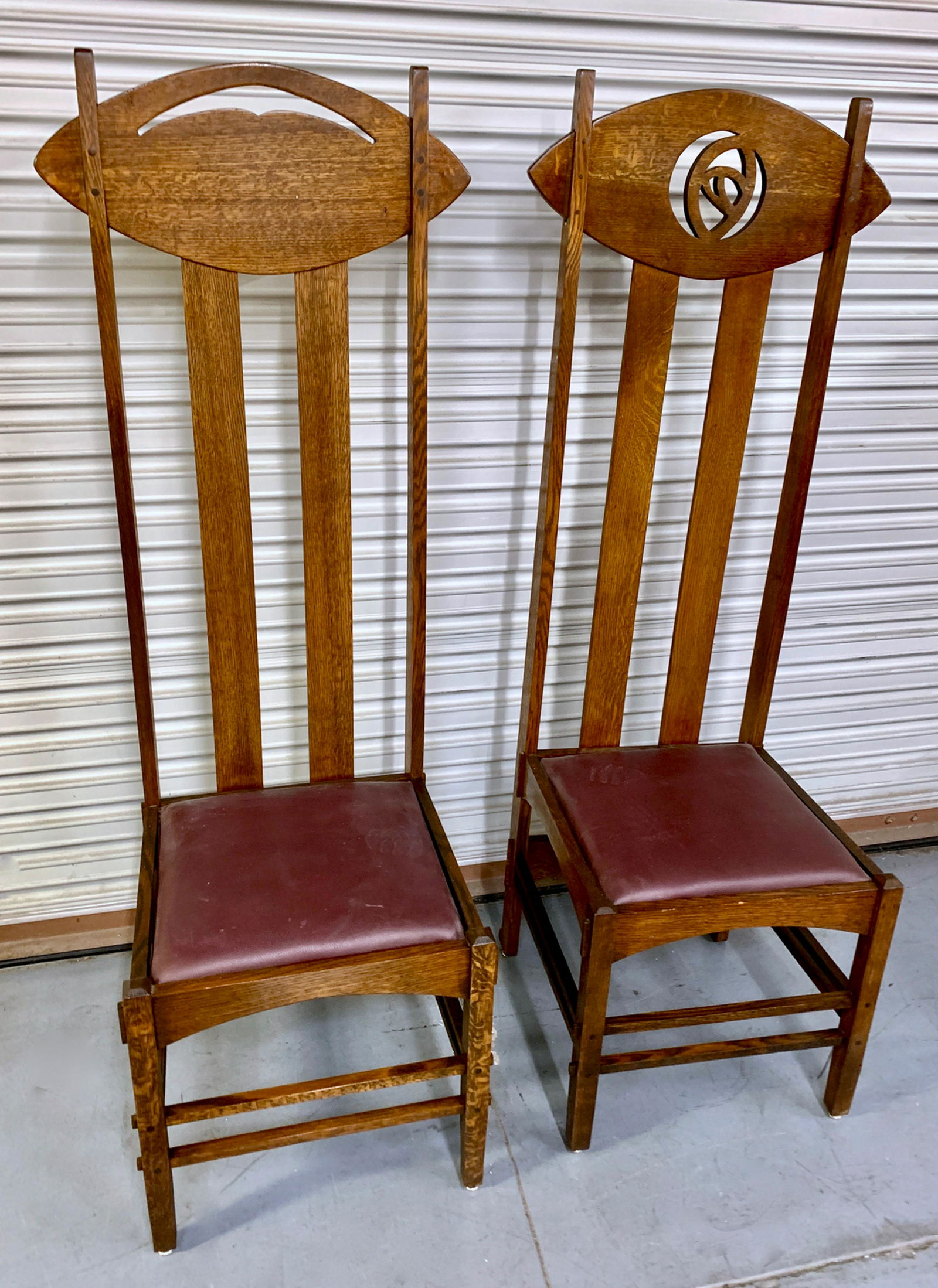 Pair Charles Rennie Mackintosh High Back Chairs: Pair of after Charles Rennie Mackintosh "Argyle" high back charis by Cassina, both high back with 2 difference signes at the top, made of oak, very good condition, 60" x 18" x 19.5"
