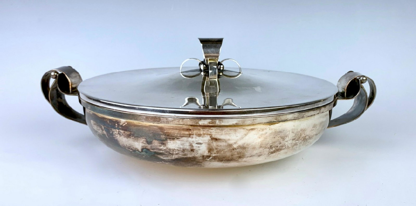 Georg Jensen Style Silver Plate Covered Bowl: Having a Georg Jensen style, silver plated with ornate handles and lid, has hallmarks for Denmark, good condition, minor scratching, 13" x 4.5"