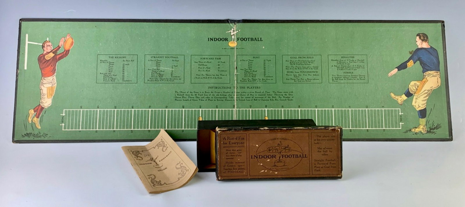 Indoor Football Game C. 1919: Neat board game from the 1920's, has copyright date 1919 by Underwood, includes rule book, 2 pegs, dice and board, good condition with minor tears, 16" x 9"