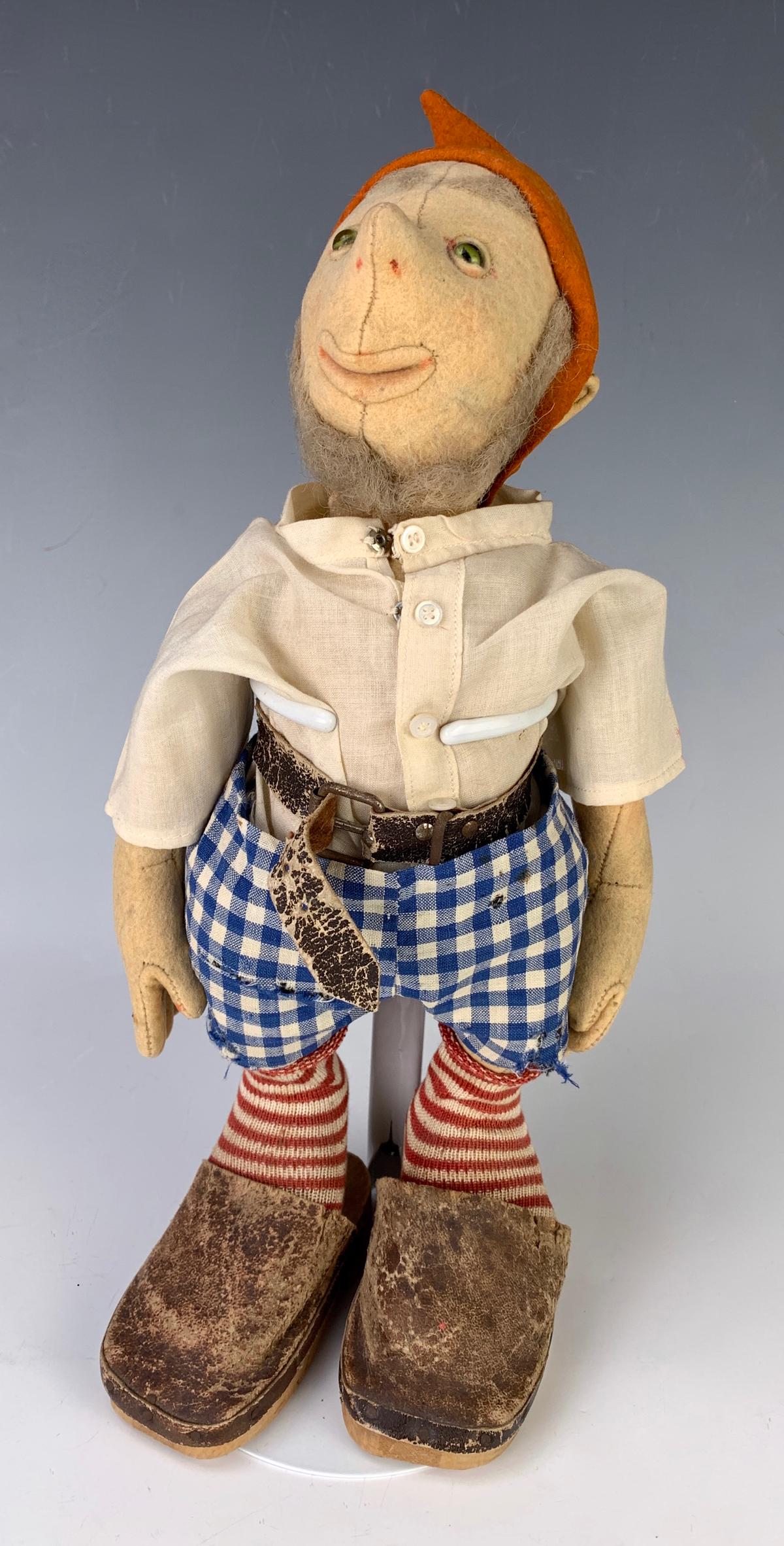 12" German Felt Gnome "Snik" by Steiff: C. 1930, green glass eyes, felt head and body jointed at shoulders and hips, swivel neck, moth hole on left arm and chest, wear to leather belt and wood clogs, costume all original, very good conditio
