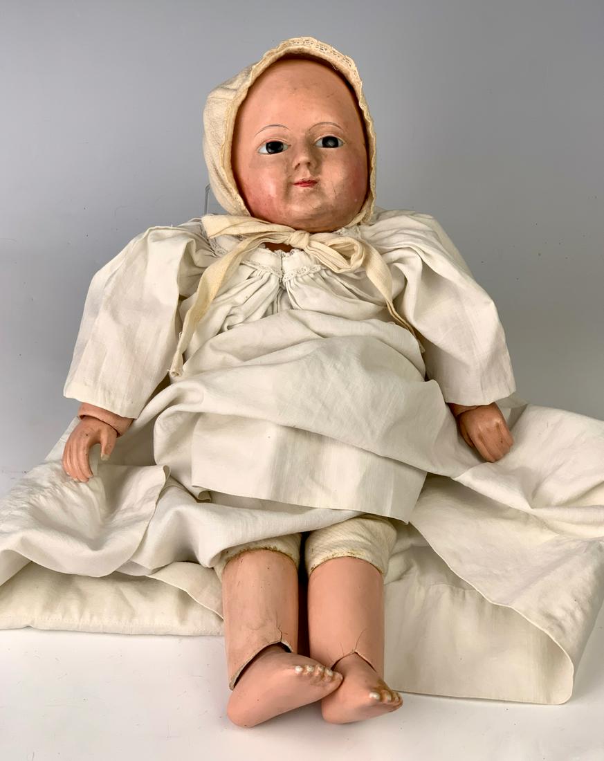14" German Papier Mache Motschmann Baby: C. 1850, dark brown enamel eyes, tufts of hair painted near temples, papier mache body jointed with cotton twill causing floating limbs, jointed at shoulders, torso, wrists, ankles and knees, swivel n