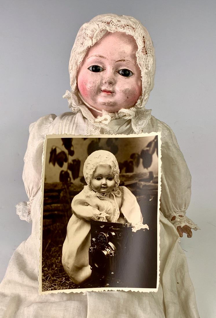 11" German Papier Mache Motschmann Baby: C. 1850, dark brown enamel eyes, tufts of hair painted near temples, papier mache body jointed with cotton twill causing floating limbs, jointed at shoulders, torso, wrists and ankles, swivel neck, sq