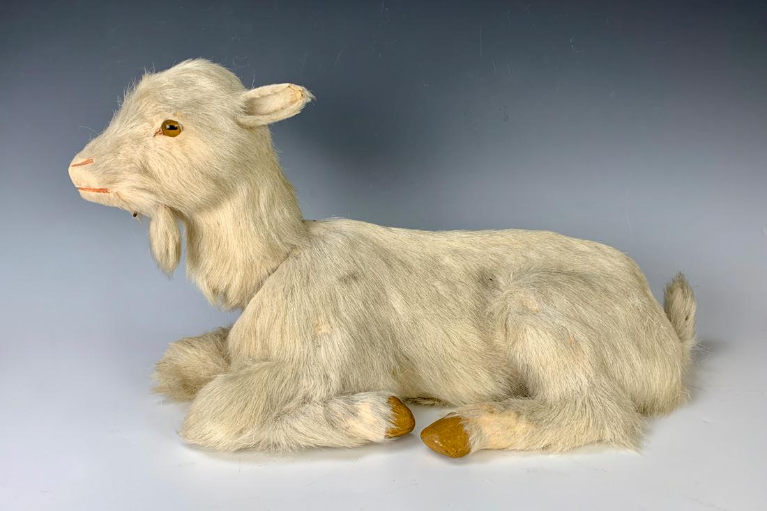 Antique Nodding "Goat" Automaton C. 1900: Having a fur covered body, articulated head, amber glass eyes and papier mache hooves, now with electric motor making the goat nod, goat in fine condition, motor not working, 20" x 12"
