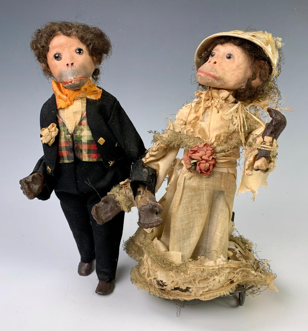 Antique Mechanical Monkey "Bride & Groom" c. 1890: Early mechanical monkey bride and groom, having a pair of monkeys with papier mache heads and glass eyes, set on an articulated oscillating mechanism, when pushed bride's head tilts side to side, good