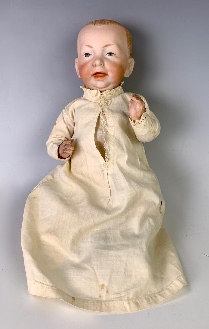 11" German Bisque Head Kaiser Baby by K*R: C. 1910, blue painted eyes, solid dome with blond painted hair, open/close mouth, five-piece composition baby body, marked "K*R 100", clothing antique (likely original), generally excellent condition